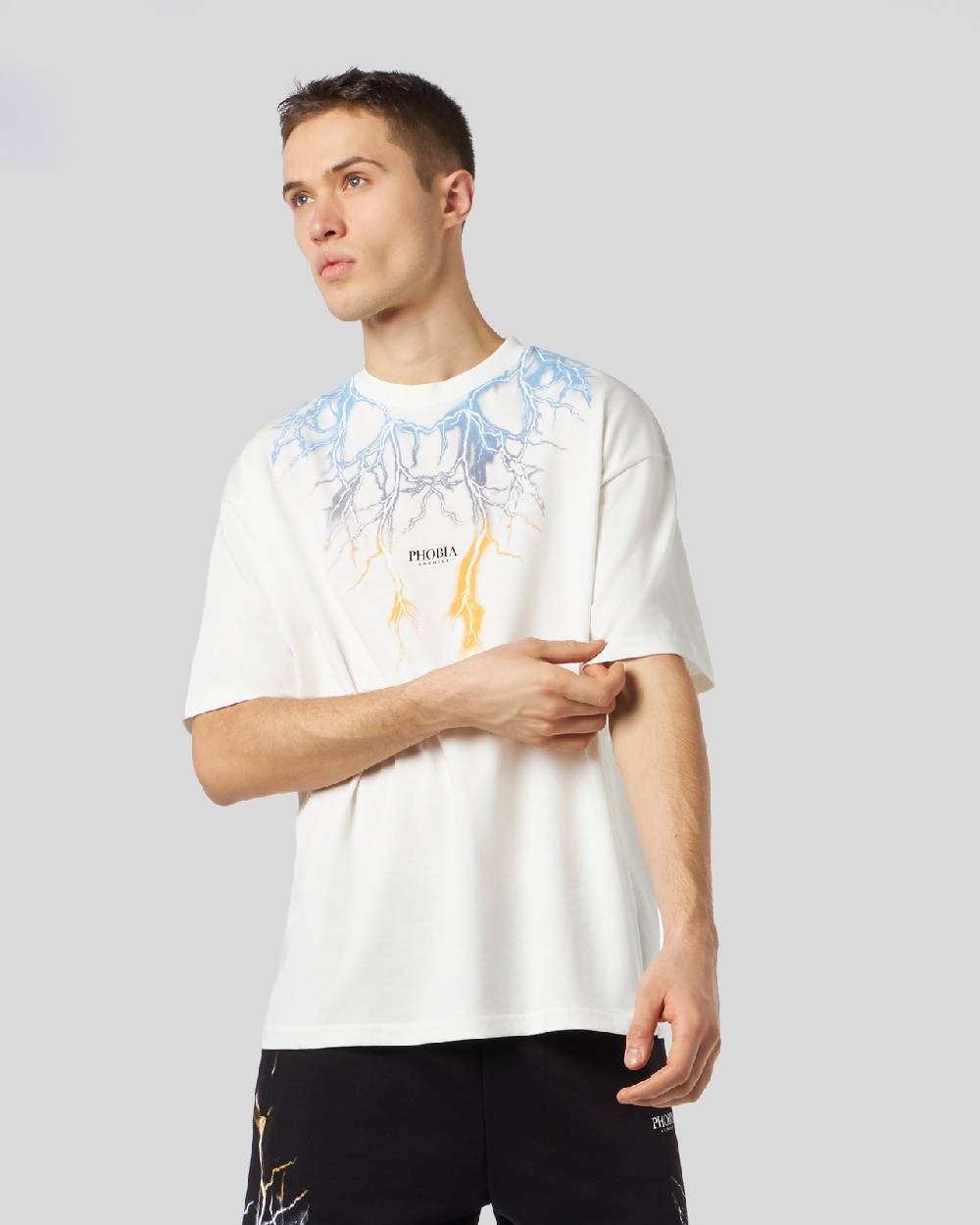 Phobia Archive T-SHIRT BIANCA CON FULMINI BICOLORE GIALLO E BLU Saldi