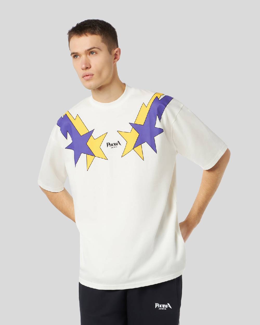 Phobia Archive T-SHIRT BIANCA CON STAMPA STARRY LIGHTNING GIALLA E VIOLA Qualità Garantita