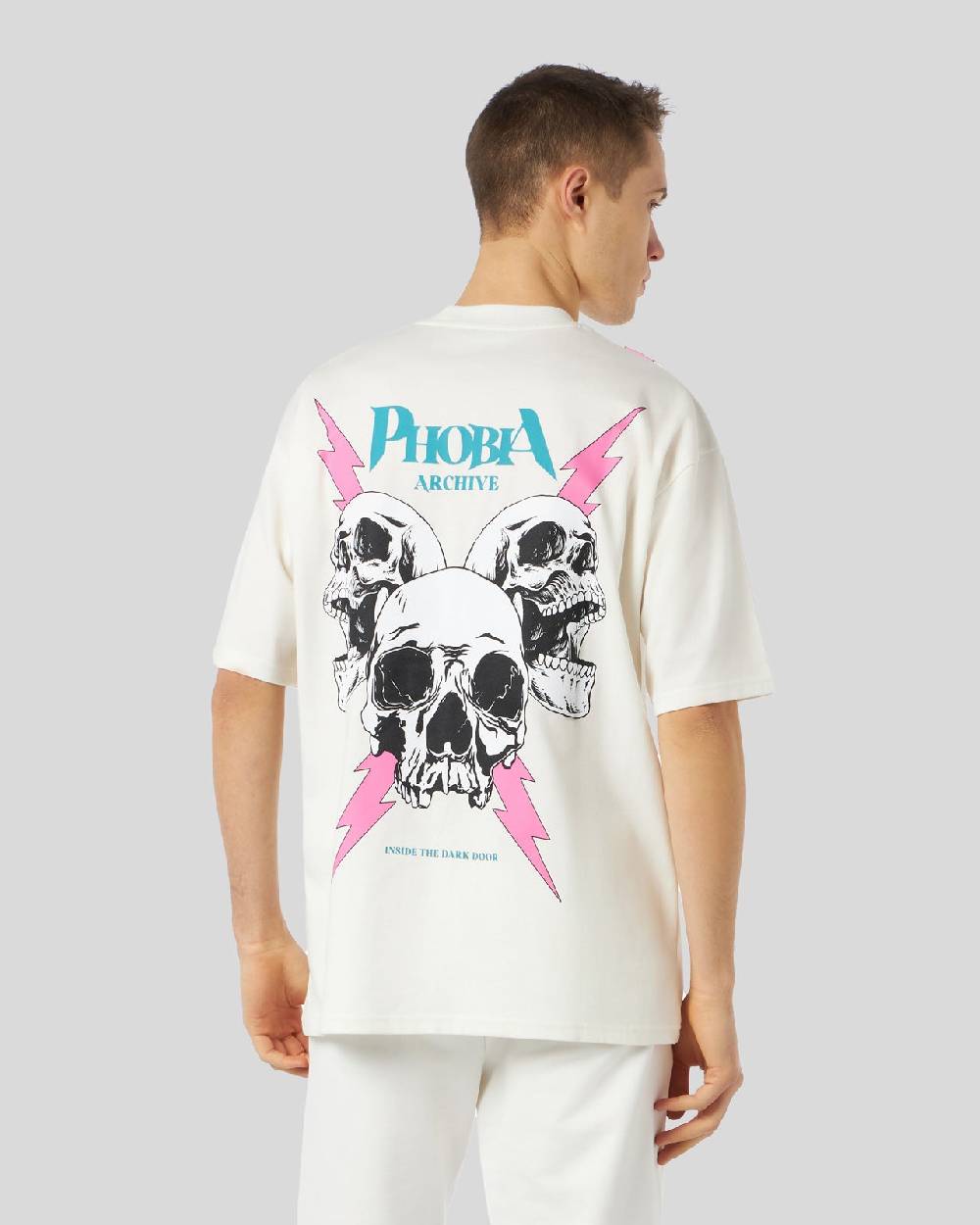 Phobia Archive T-SHIRT BIANCA CON GRAFICA SCREAMING SKULLS ROSA Convenienza